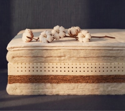 Layers of natural mattress materials, including cotton, wool, latex, and coconut coir